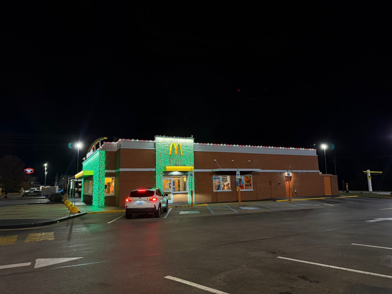 McDonalds building side elevation with green light curtains and warm roofline lighting, Bowling Green KY